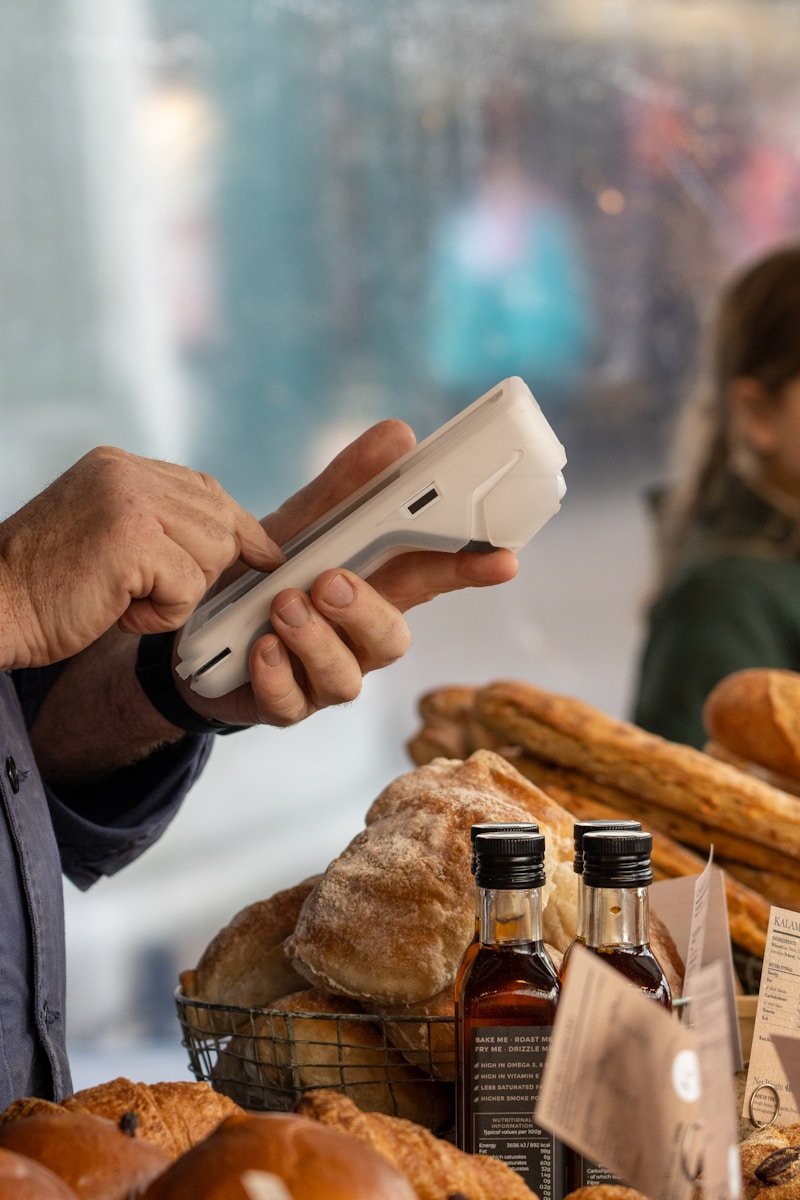 Home a person holding a bottle of alcohol